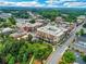 An aerial view highlighting the neighborhood's attractive buildings and lush green trees at 150 Shady Grove Ln, Alpharetta, GA 30009