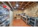 Unfinished basement offers ample storage with shelving, workbench, and exposed ceiling, ready for customization and projects at 150 Shady Grove Ln, Alpharetta, GA 30009