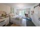 Bright bedroom with hanging chair, chandelier, and white furniture at 150 Shady Grove Ln, Alpharetta, GA 30009