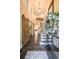 Inviting foyer with wood floors, staircase, and decorative accents at 150 Shady Grove Ln, Alpharetta, GA 30009