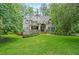 Charming two-story home with landscaped yard at 150 Shady Grove Ln, Alpharetta, GA 30009