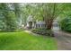 Charming home with a manicured lawn, stone accents, and a welcoming front porch at 150 Shady Grove Ln, Alpharetta, GA 30009