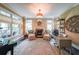 Elegant home office features a fireplace, large windows, and designer decor at 150 Shady Grove Ln, Alpharetta, GA 30009