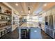 Bright kitchen with island seating, stainless appliances, and custom shelving at 150 Shady Grove Ln, Alpharetta, GA 30009