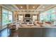 Spacious living room with custom built-ins, fireplace, and large windows offering natural light at 150 Shady Grove Ln, Alpharetta, GA 30009
