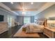 Tranquil main bedroom with tray ceilings, sitting area, and lots of natural light at 150 Shady Grove Ln, Alpharetta, GA 30009