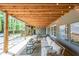 Inviting outdoor patio with string lights, comfortable seating, and a view of the lush backyard, perfect for entertaining at 150 Shady Grove Ln, Alpharetta, GA 30009