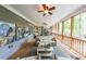 Relaxing screened-in porch with comfortable seating area and beautiful wooded views at 150 Shady Grove Ln, Alpharetta, GA 30009