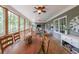 Relaxing screened-in porch featuring an outdoor dining area with wooded views at 150 Shady Grove Ln, Alpharetta, GA 30009
