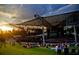 Outdoor venue with a large stage and lawn seating area for a concert or event at 150 Shady Grove Ln, Alpharetta, GA 30009