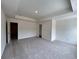 Spacious carpeted bedroom with modern lighting and ample natural light at 1956 Asher Ln # 51, Conyers, GA 30013