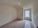 Cozy carpeted bedroom with natural light streaming through the window at 1956 Asher Ln # 51, Conyers, GA 30013