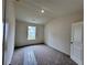 Carpeted bedroom with natural light from a window and closet at 1956 Asher Ln # 51, Conyers, GA 30013