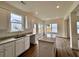 Bright kitchen area with white cabinets and countertops at 1956 Asher Ln # 51, Conyers, GA 30013
