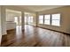 Living room with hardwood floors and a view of the kitchen and backyard at 1956 Asher Ln # 51, Conyers, GA 30013