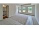 Spacious main bedroom with three windows and an ensuite bathroom entrance at 1956 Asher Ln # 51, Conyers, GA 30013