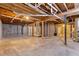 Unfinished basement with exposed beams and concrete walls, ready for customization at 3881 Moore Rd, Ellenwood, GA 30294