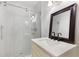 Bathroom features a sink, vanity, and stand up shower with glass door at 3881 Moore Rd, Ellenwood, GA 30294