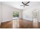 Bedroom features hardwood floors and sliding glass door to outdoor patio area at 3881 Moore Rd, Ellenwood, GA 30294