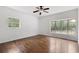 Spacious bedroom with large windows and hardwood floors with natural light at 3881 Moore Rd, Ellenwood, GA 30294
