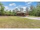 Charming brick home with a covered porch and ample parking on an oversized driveway at 3881 Moore Rd, Ellenwood, GA 30294
