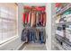 Walk-in closet features shelving and hanging racks, providing ample storage space and organization at 7246 Alicias Way, Morrow, GA 30260