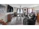Comfortable living room with large TV, leather couches, a ceiling fan, and sliding glass doors at 7246 Alicias Way, Morrow, GA 30260
