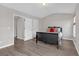 Spacious main bedroom with wood floors, neutral walls, and bright natural light at 7246 Alicias Way, Morrow, GA 30260