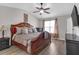Main bedroom with a ceiling fan, plush bed set, and an abundance of natural light at 7246 Alicias Way, Morrow, GA 30260