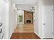 Inviting foyer view into a spacious living room with a stone fireplace and wood floors at 1360 Terramont Dr, Roswell, GA 30076
