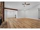 Living room featuring wood floors and an open floorplan with a kitchen and dining area at 1360 Terramont Dr, Roswell, GA 30076