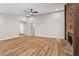 Open living room featuring wood floors, modern recessed lighting, and access to other rooms at 1360 Terramont Dr, Roswell, GA 30076