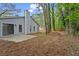 A large backyard with patio and beautiful trees at 1360 Terramount Dr, Roswell, GA 30076