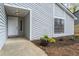 Inviting front porch with a new door, wood planter box and manicured garden at 1360 Terramount Dr, Roswell, GA 30076