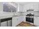 Bright kitchen featuring stainless steel appliances, granite countertops, and wood-look flooring at 1360 Terramount Dr, Roswell, GA 30076