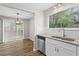 Bright kitchen featuring granite countertops, stainless steel appliances and a large window at 1360 Terramount Dr, Roswell, GA 30076