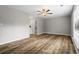 Spacious living room featuring wood-look floors and an en-suite bathroom at 1360 Terramount Dr, Roswell, GA 30076