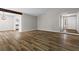 Open living room with wood floors and views to kitchen and entryway at 1360 Terramount Dr, Roswell, GA 30076
