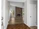 Open-concept living room featuring a stone fireplace and new hardwood floors at 1360 Terramount Dr, Roswell, GA 30076