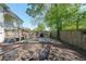 Backyard with wooden walkway, patio, firepit, and fencing at 224 Bass Sw St, Atlanta, GA 30315