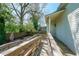 View of the backyard showcasing a patio and wooden walkway at 224 Bass Sw St, Atlanta, GA 30315