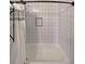 Clean bathroom featuring white tile, a built in niche, and a shower curtain at 224 Bass Sw St, Atlanta, GA 30315