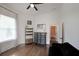 Spare bedroom features dark wood floors and comfortable furnishings including a dark-fabric sofa at 224 Bass Sw St, Atlanta, GA 30315