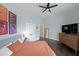 Light-filled bedroom boasts art, wood floors, and comfortable furnishings for relaxation and restful sleep at 224 Bass Sw St, Atlanta, GA 30315