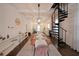 Elegant dining area with a view to the kitchen and a unique spiral staircase, perfect for dinner parties at 224 Bass Sw St, Atlanta, GA 30315