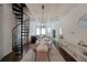 Open dining area with a spiral staircase, seamlessly connecting to the living room and kitchen at 224 Bass Sw St, Atlanta, GA 30315