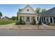 Charming home featuring a classic white exterior, inviting front porch, and beautifully landscaped yard at 224 Bass Sw St, Atlanta, GA 30315