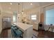 Contemporary kitchen with stainless steel appliances, white subway tile backsplash, and spacious island at 224 Bass Sw St, Atlanta, GA 30315