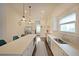 Well-lit kitchen with stainless steel appliances, a center island with seating, and tiled accents at 224 Bass Sw St, Atlanta, GA 30315