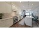 Bright kitchen features stainless steel appliances, a large island, and seamless access to the living space at 224 Bass Sw St, Atlanta, GA 30315